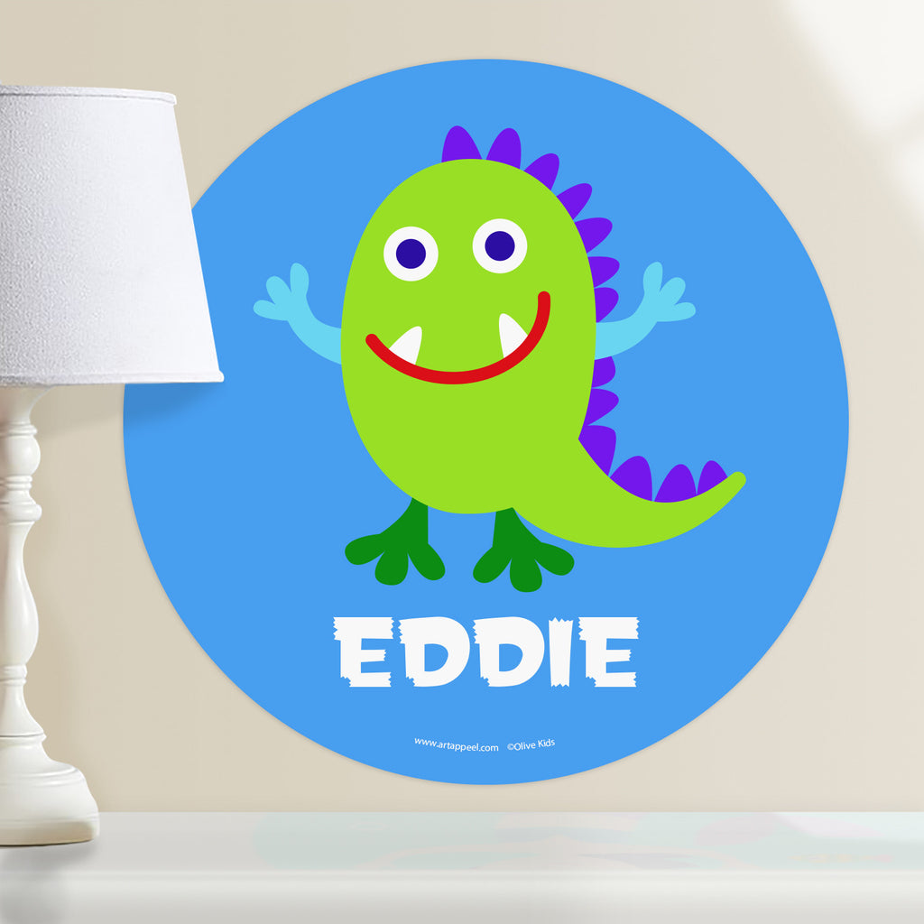 Monster themed kids personalized circular wall decal, with a happy green little monster on a blue background.