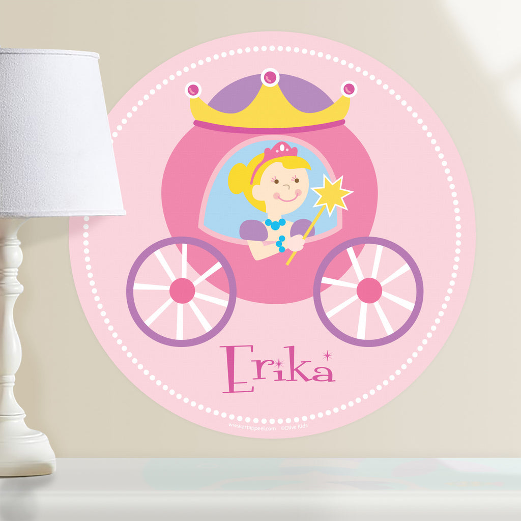 Princess personalized wall decal.  Circular shape, with blonde princess sitting in her pink and purple coach. Light pink background.
