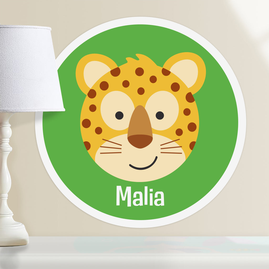 Kids personalized circular wall decal. Happy baby leopard on a bright green background. background.